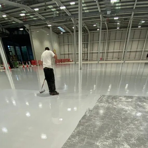 Bespoke Epoxy Solutions LTD applying a gre Epoxy resin floor Belfast | Northern Ireland